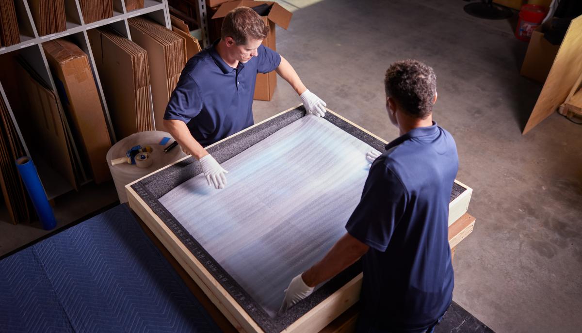 Safe packing of a valuable painting into a crate