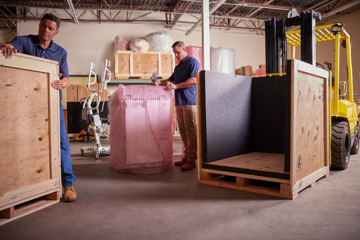 Preparing medical and commercial equipment for custom crating at Navis Pack and Ship of Phoenix
